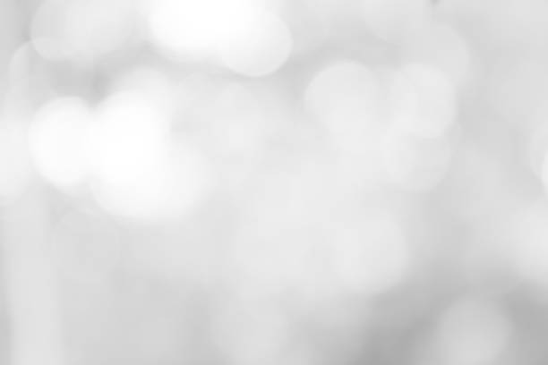 istock white blurred backdrop of nature, circle white wallpaper, gray bokeh background 968677610