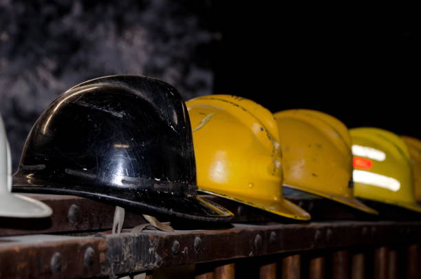 istock Colorful firefighter helmets lined up on an old fire truck 968696834