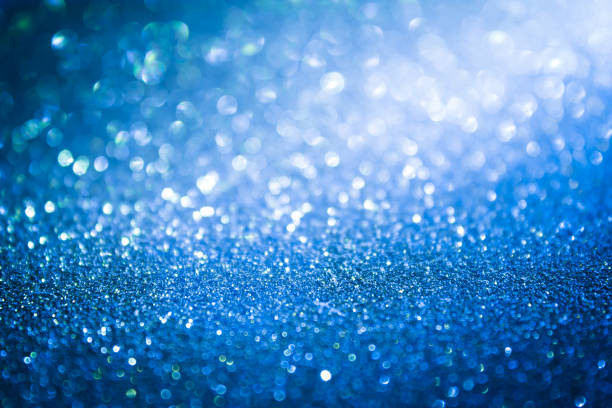 istock blue blur abstract background. bokeh christmas blurred beautiful shiny Christmas lights. 968699076