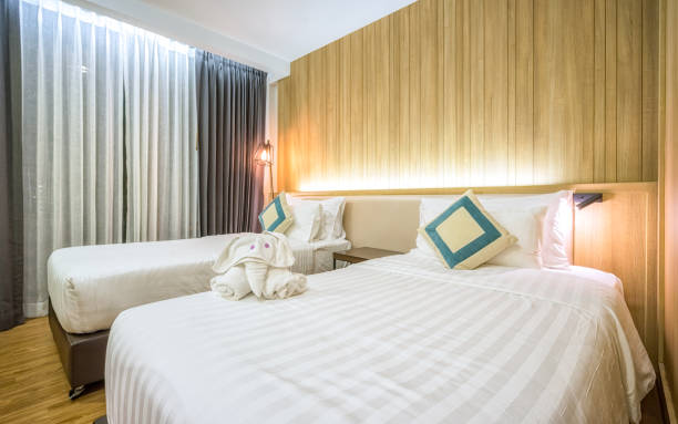 istock Bed and nightstand in modern bedroom and equipment for a comfortable and restful experience. 968706230