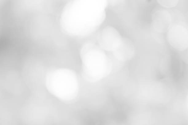 istock white blurred backdrop of nature, circle white wallpaper, gray bokeh background 968714338