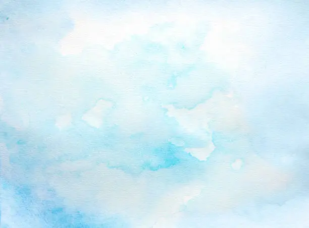 Abstract wet blue watercolor background  on white watercolor paper. My own work.