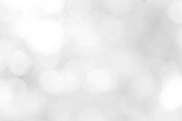 istock white blurred backdrop of nature, circle white wallpaper, gray bokeh background 968718884