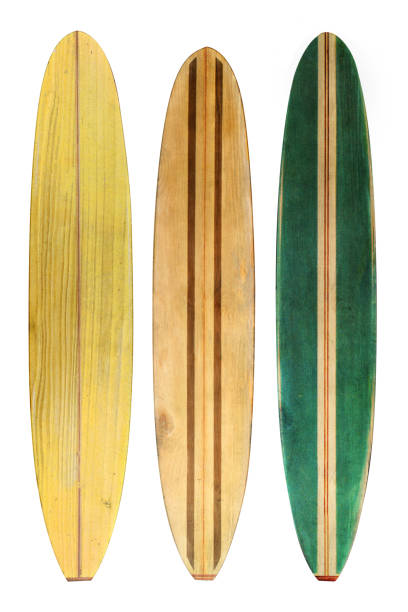 Vintage surfboard Vintage wood surfboard isolated on white with clipping path for object, retro styles. longboarding stock pictures, royalty-free photos & images
