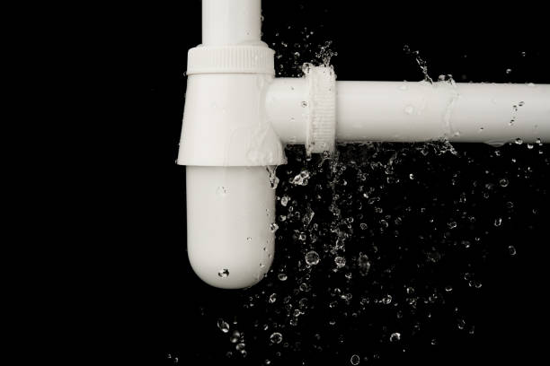 istock Leaking of water from sink pipe on black background 968723498