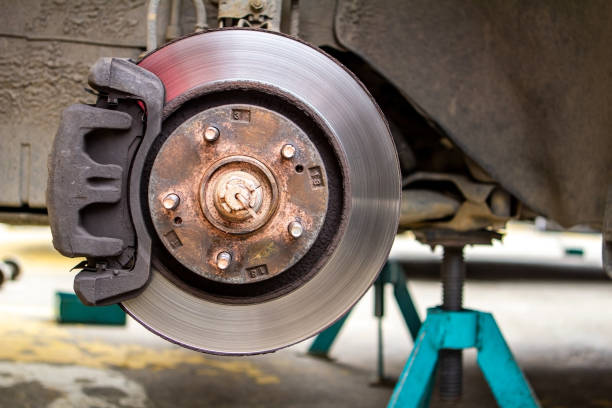 istock brake discs on the machine with the removed wheels on the jacks. wheel replacements 968734712
