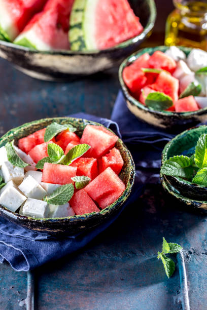 istock Watermelon cheese and mint salad with olive oil. Close up 968774352