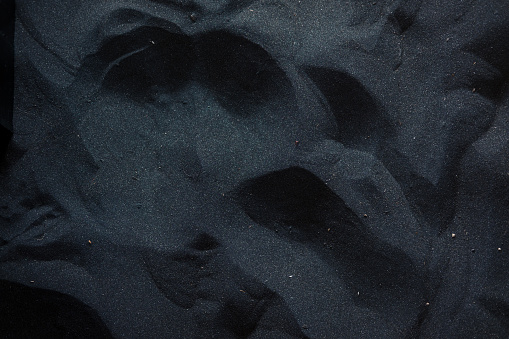 Black sand floor texture from above. Interior, exterior design ideas