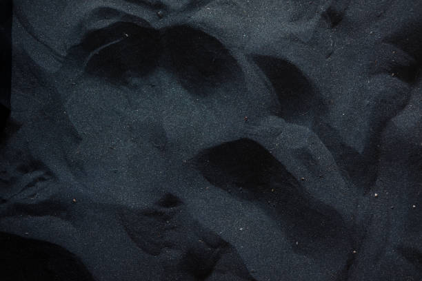 Black sand floor texture stock photo