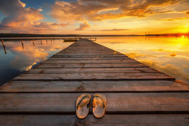 istock Small Dock and Boat at the lake, sunset shot 968785706
