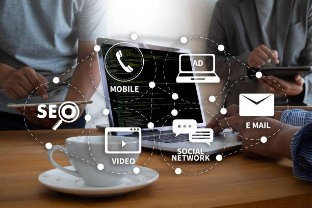 istock DIGITAL MARKETING new startup project MILLENNIALS Business team hands at work with financial reports and a laptop 968788598