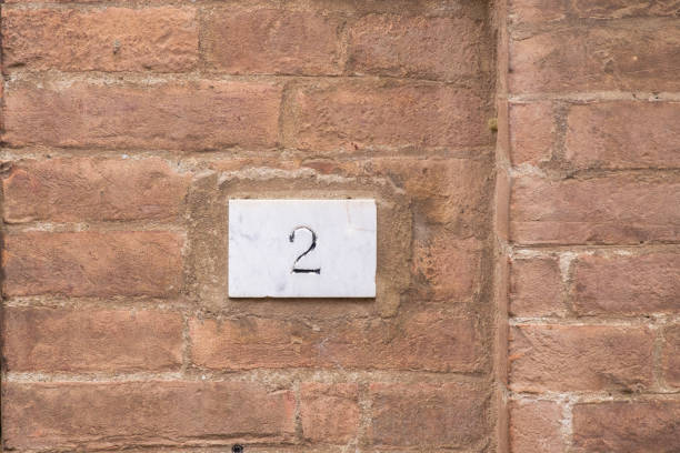 istock Old house sign with the number two 968802354