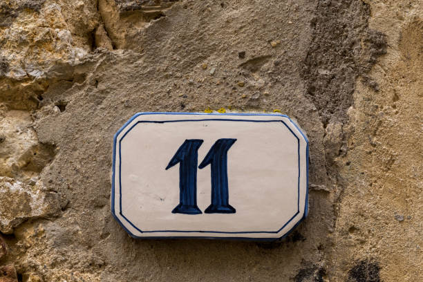istock Old house sign with the number eleven 968802362