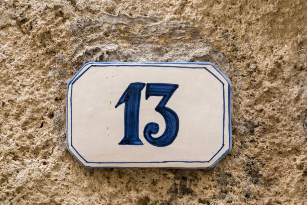 istock Old house sign with the number thirteen 968802364