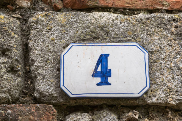 istock Old house sign with the number four 968802374