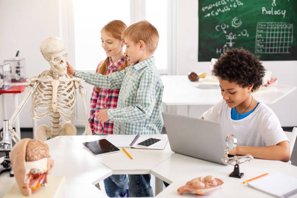 istock Smart young boy sitting at the laptop 968809718