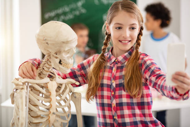 istock Joyful cheerful girl taking a photo 968812032
