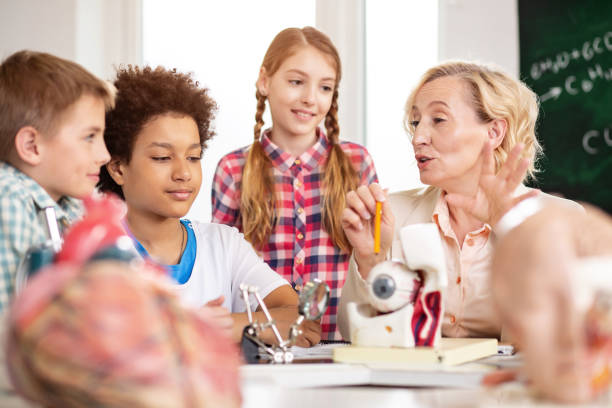 istock Pleasant smart woman pointing at the eye 968812686