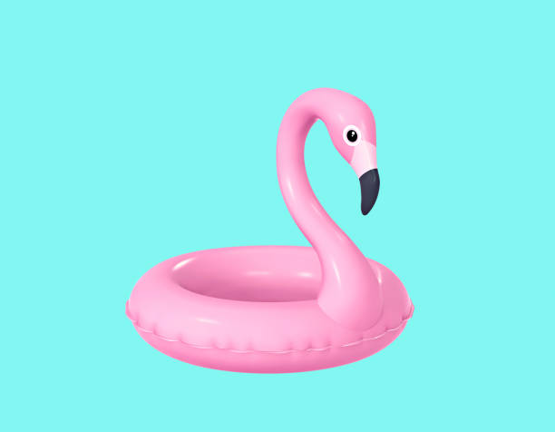 inflable flamingo aislado sobre fondo turquesa - flotador fotografías e imágenes de stock