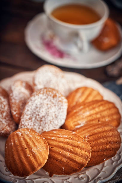 istock Homemade Madeleine Cakes served with Cup of Tea 968819232