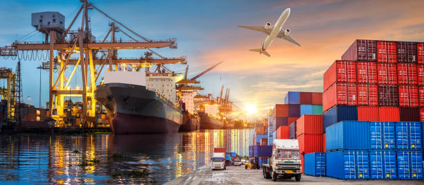 istock Container Cargo freight ship with working crane bridge in shipyard at twilight for Logistic Import Export background 968819958