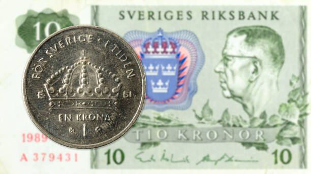 istock 1 swedish krona coin against 10 swedish krona note 968825592