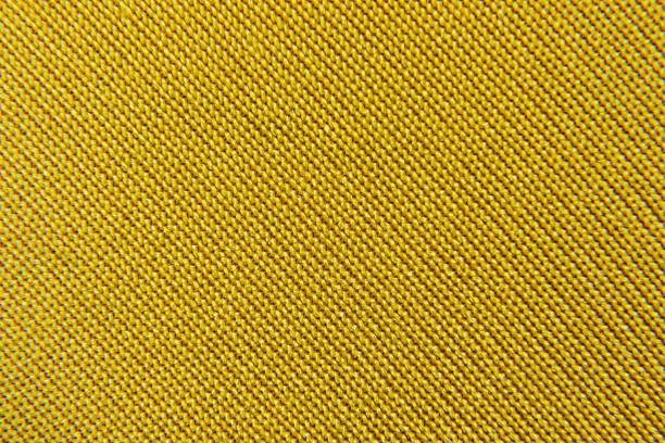 abstract background of yellow fabric close-up - artex imagens e fotografias de stock