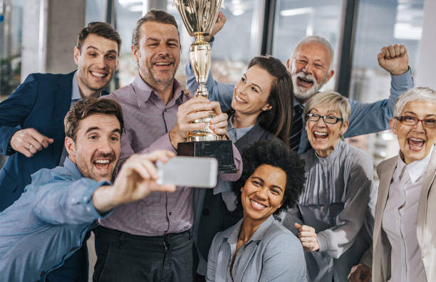 istock Everyone smile for a photo with a trophy! 968830722