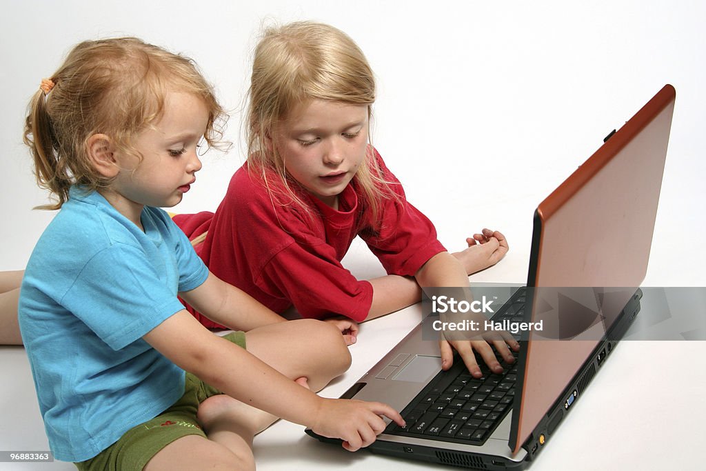 Playing on laptop  Baby - Human Age Stock Photo