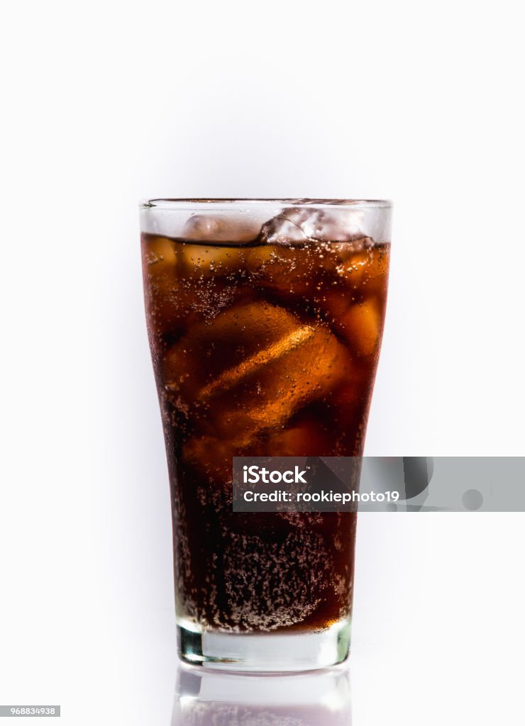 Soft drink Glass of soft drink with reflection on white background. Cola Stock Photo