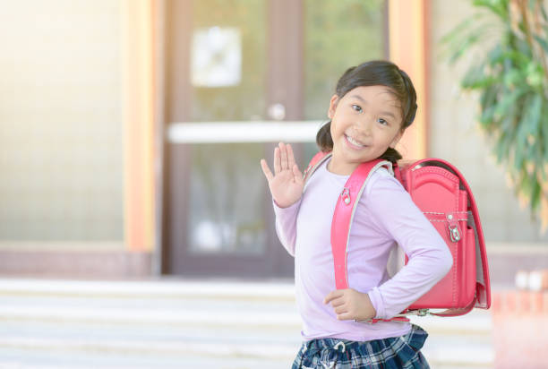 istock Asian student going to school and waving goodbye 968837860