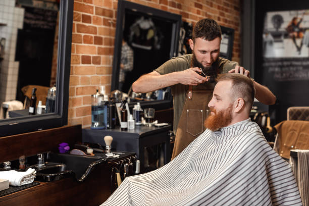 istock Barber and bearded man in barber shop 968838762