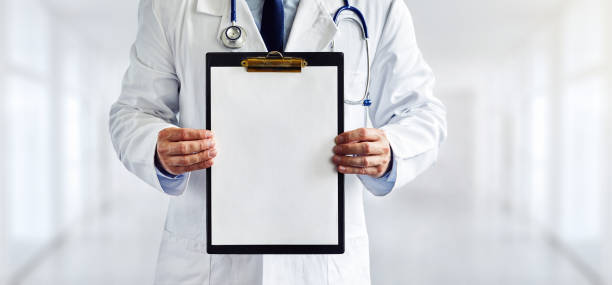 Male doctor with the blank clipboard in the hospital Male doctor with the blank clipboard in the hospital clipboard stock pictures, royalty-free photos & images