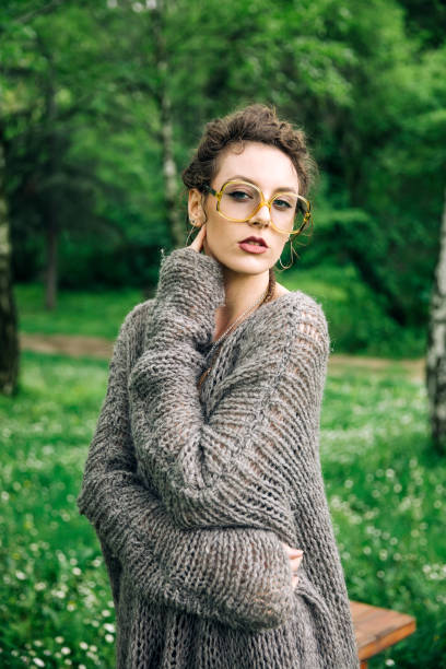 istock Pretty young woman with eyeglasses in the forest 968846332
