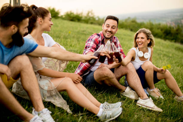 istock Group od young people drinking and having fun on a trip in nature on mountain 968849516
