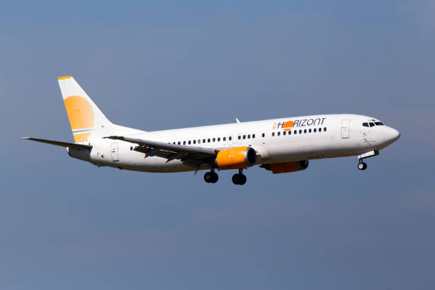 9H-ZAZ Air Horizont Boeing 737-400 aircraft on the blue sky background stock photo