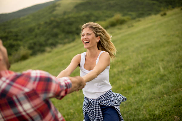 istock Loving coulpe having fun in the spring nature 968849598