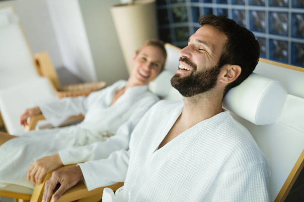 istock Attractive happy couple relaxing in spa center 968859370