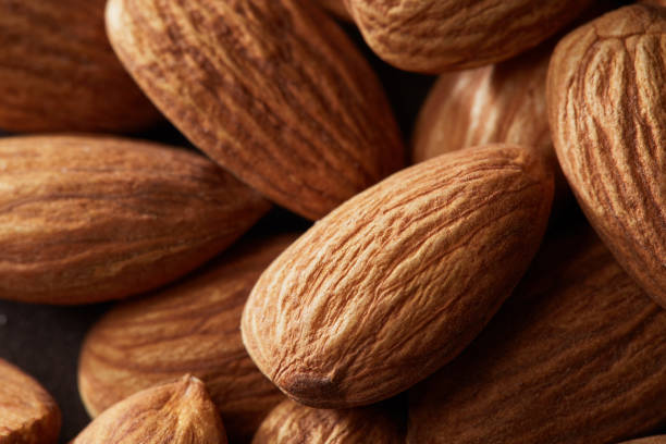 istock Background of big raw peeled almonds macro shot 968859526