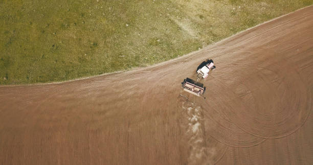 istock Aerial view of Tractor plowing fields -preparing land for sowing 968859952