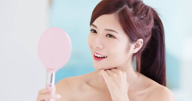 istock beauty woman take mirror 968860280