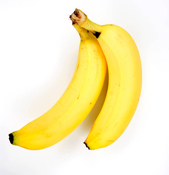 Two ripe yellow bananas on a white background stock photo