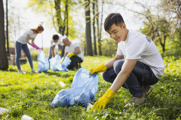 istock Handsome male volunteer taking trash 968872166