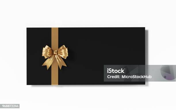 Black Gift Card With Gold Colored Bow Tie On White Background Stock Photo - Download Image Now