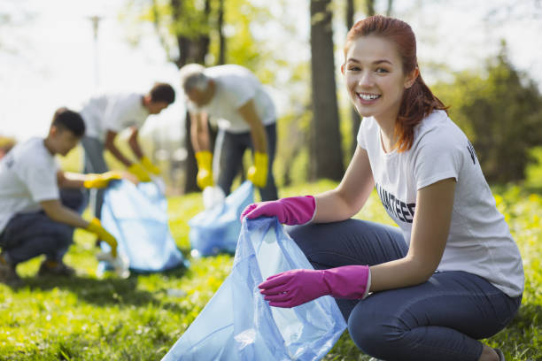 istock Happy female volunteer serving nature 968872338