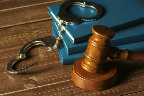 istock Gavel With Books On Old Wooden Desk 968878546