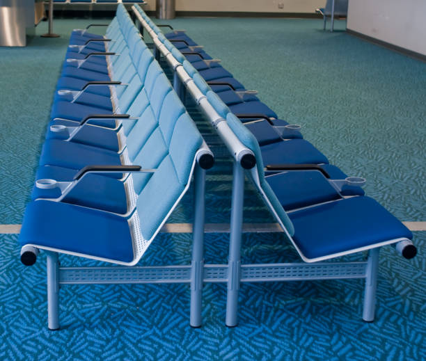 istock Two rows of blue chairs in airport 96887874