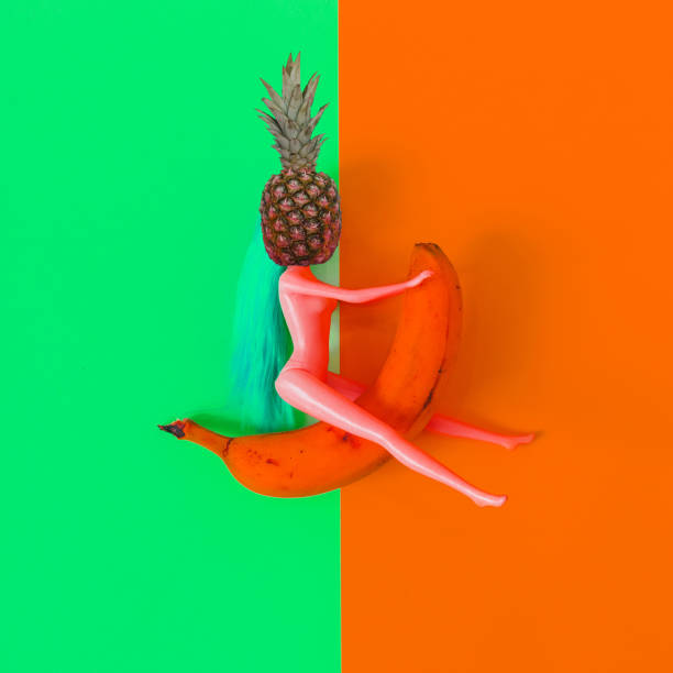 doll with pineapple instead of a head riding a banana.