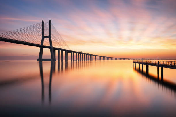 istock Bridge Lisbon at sunrise, Portugal - Vasco da Gamma 968887290