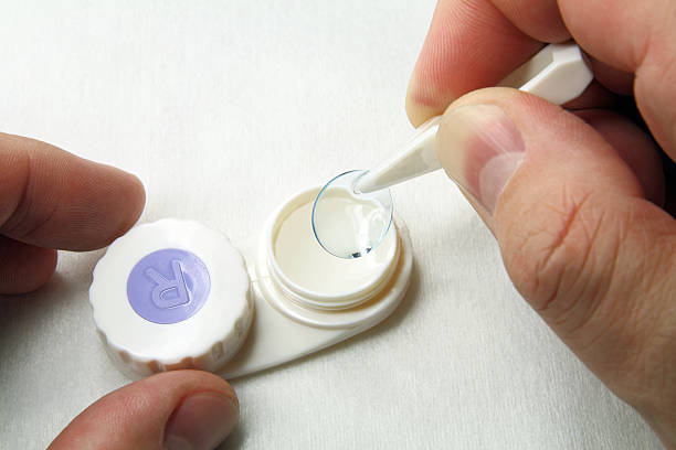 istock Hand with tweezers and contact lens 96888894